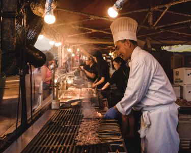 Chef cooking and grilling at the Richmond Night Market in Richmond, BC