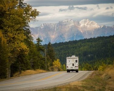 A camper on Highway 3 heading east towards the Steeples outside of Cranbrook, BC