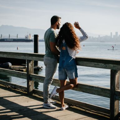 Two people looking out on the water.