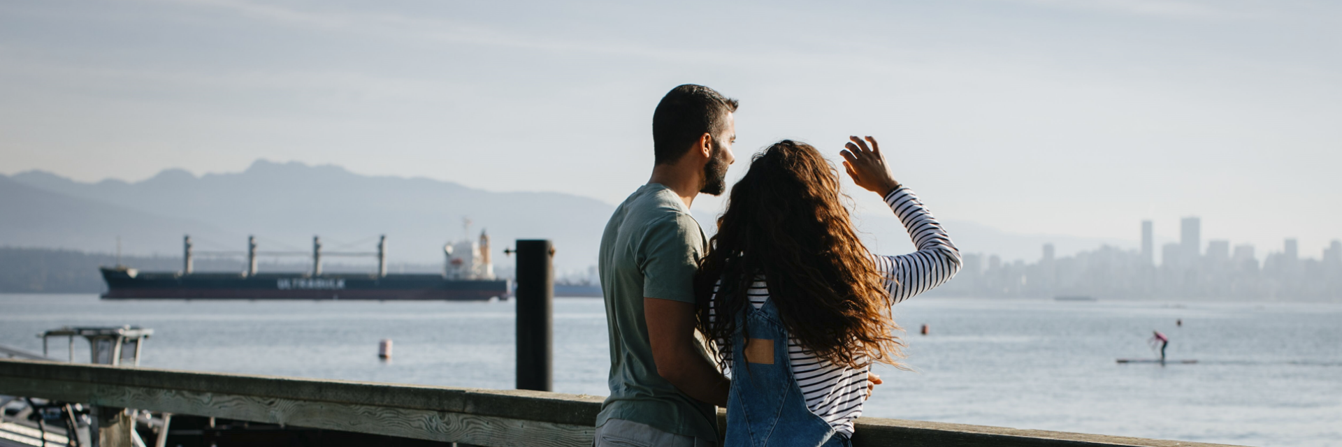 Two people looking out on the water.
